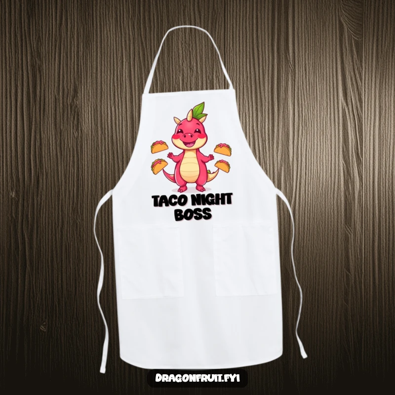 Funny apron showing a smiling dragonfruit character masterfully juggling three tiny, dancing tacos, ideal for a humorous kitchen.