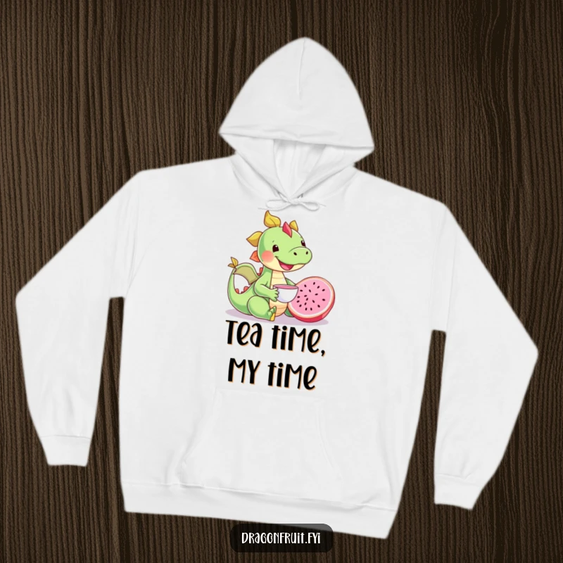 Funny happy dragonfruit character enjoying a tea party with a tiny teacup, a comfortable and humorous hoodie.