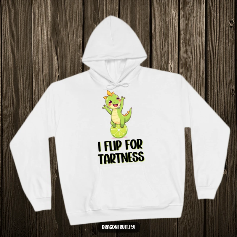 Funny dragonfruit doing a handstand on a lime, looking cheerful on a cozy hoodie, a perfect funny gift.