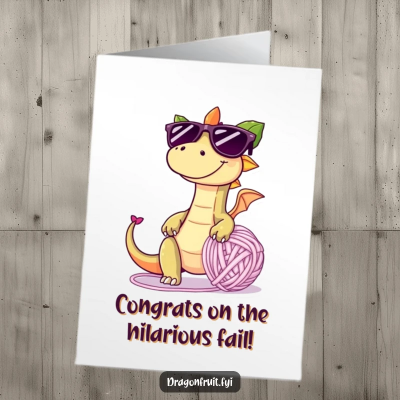 Funny Free Printable Congrats Card: A mischievous dragonfruit in sunglasses playfully trips over a giant yarn ball, celebrating your big win messily.