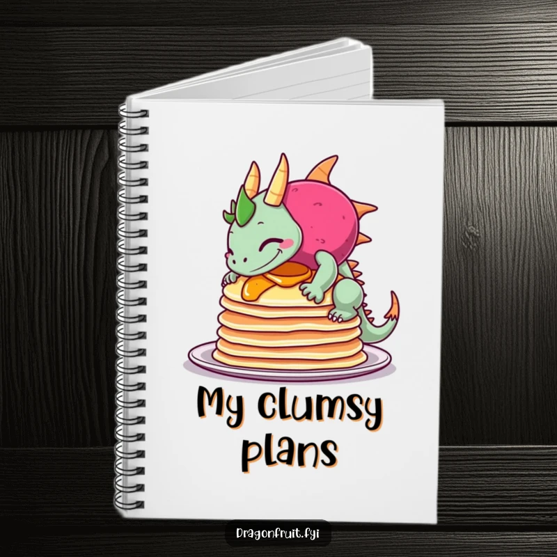 Funny notebook depicting a dragonfruit sheepishly grinning as it comically tips over a stack of pancakes, ideal for jotting ideas.