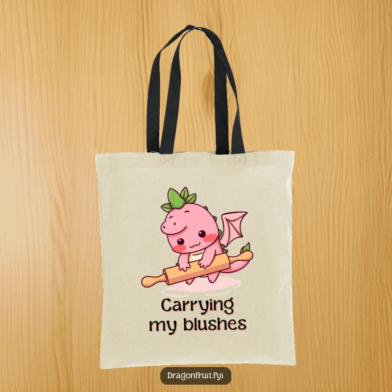 Funny tote bag featuring a blushing dragonfruit character tripping over a rolling pin, ideal for carrying kitchen supplies humorously.